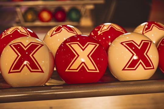 Lucky Strike X balls sitting on a rack